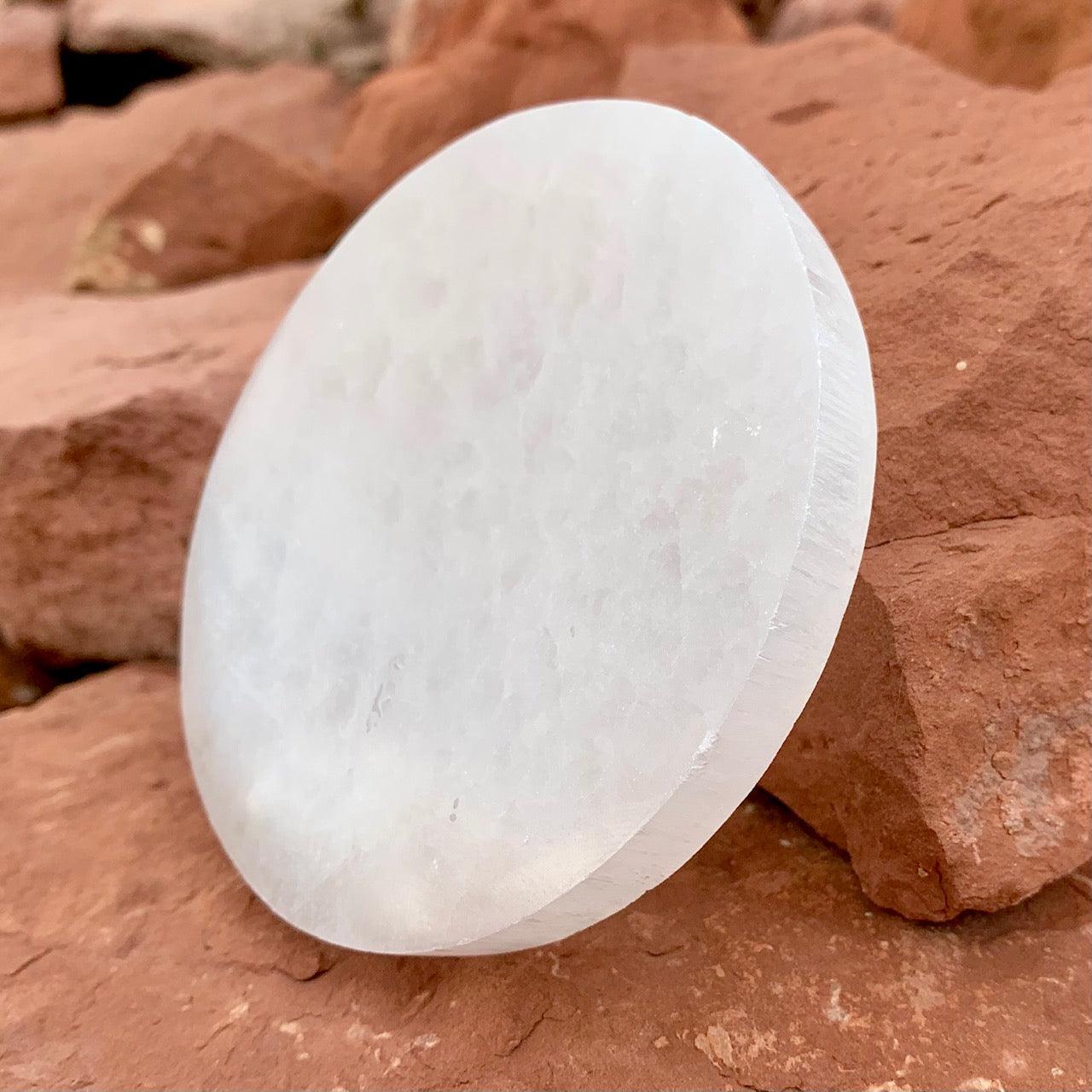 Selenite altar plate glowing with crystal interior light