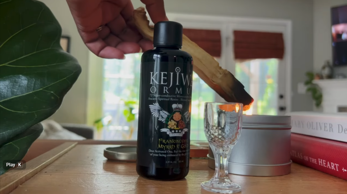 Load video: A ritual smudging with Palo Santo and a bottle of Kejiwa's Frankincense, Myrrh &amp; Gold Ormus using the little ritual glass.